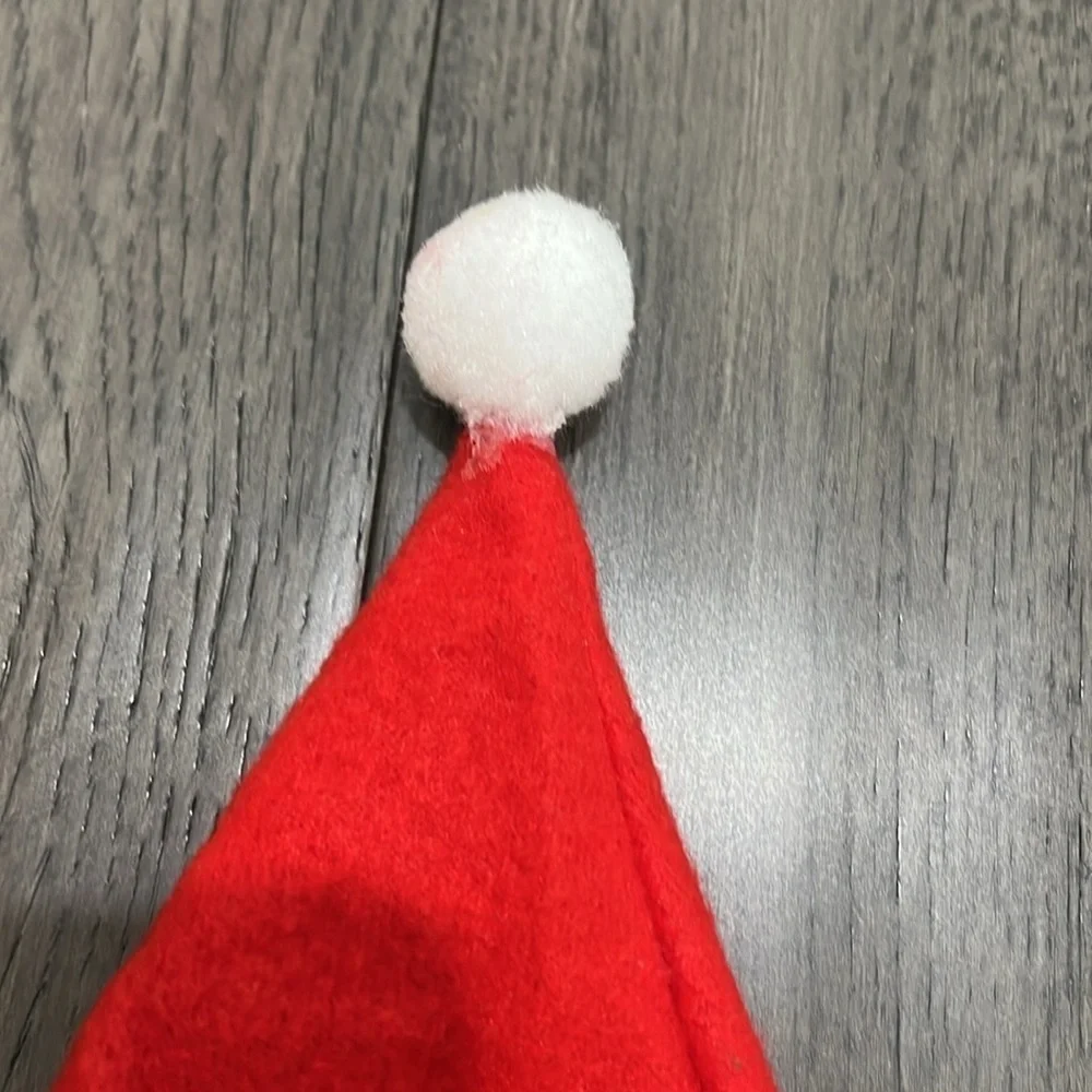 NWOT infant Santa hat with matching sock booties with pom-poms